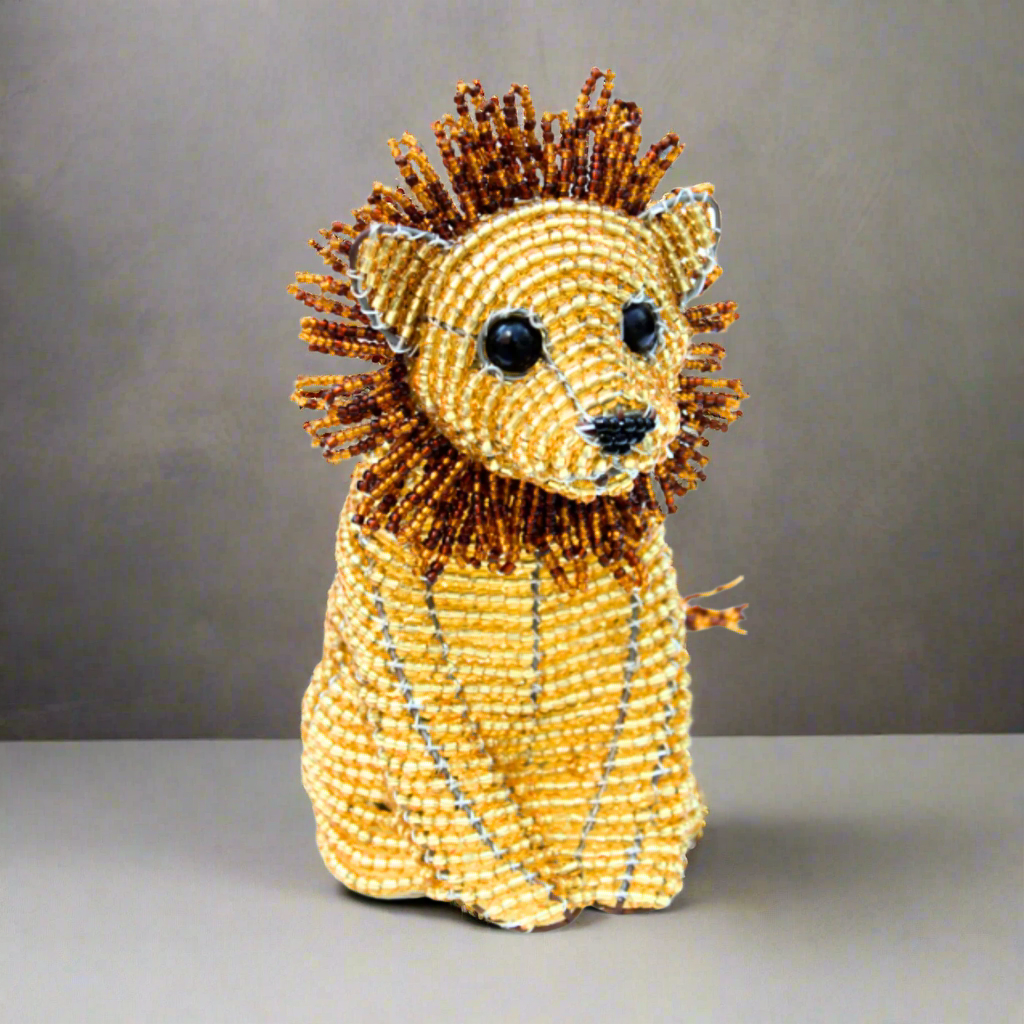 This whimsical baby lion is a great addition to a babies nursery or collectors of wild animals alike!